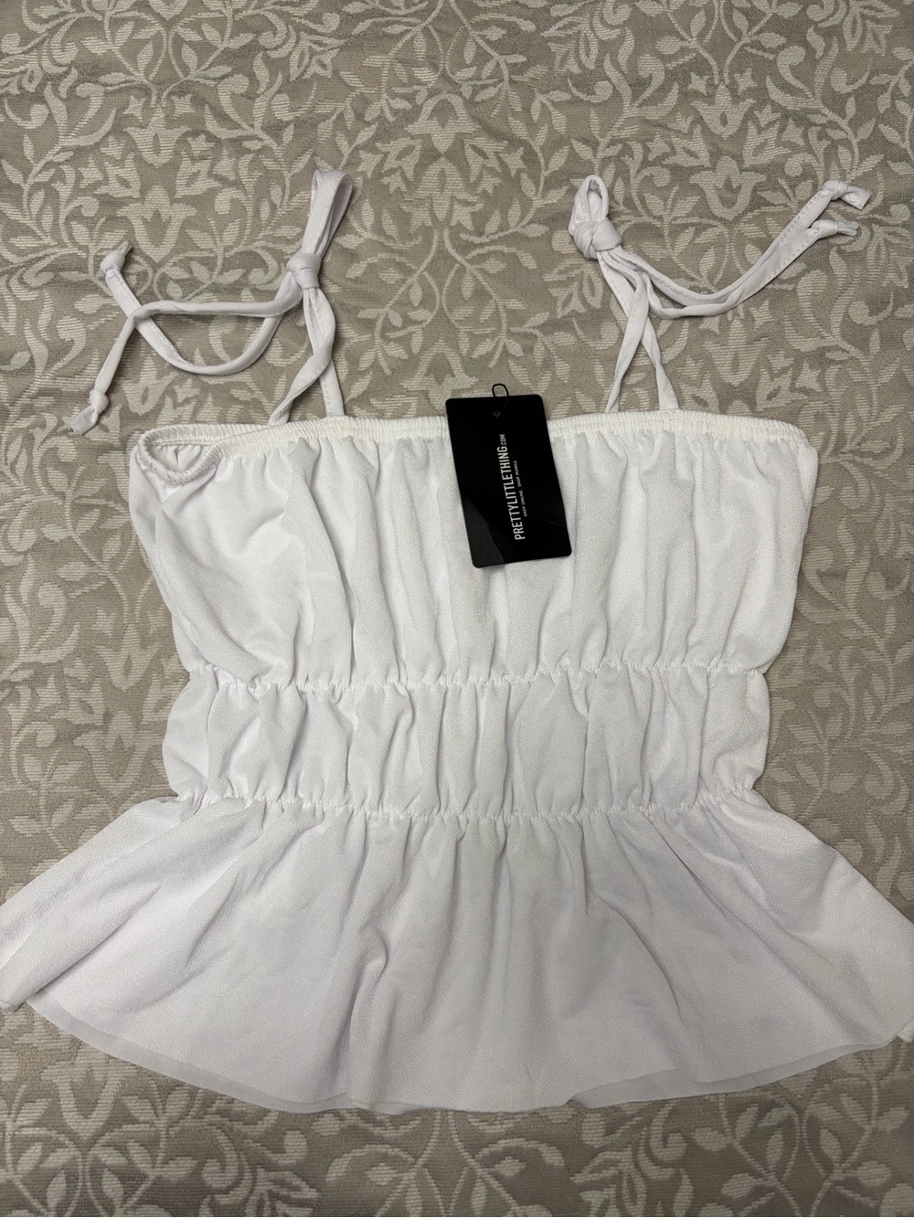 PrettyLittleThing White Shirred Peplum Cami with Tie Straps